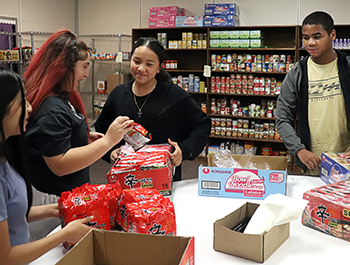 Duluth Middle School students helping out in the school food pantry